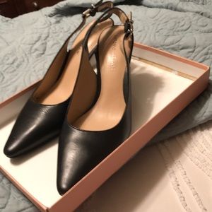 Like new navy leather sling back shoes with a pointed toe. Antonio Melani brand.